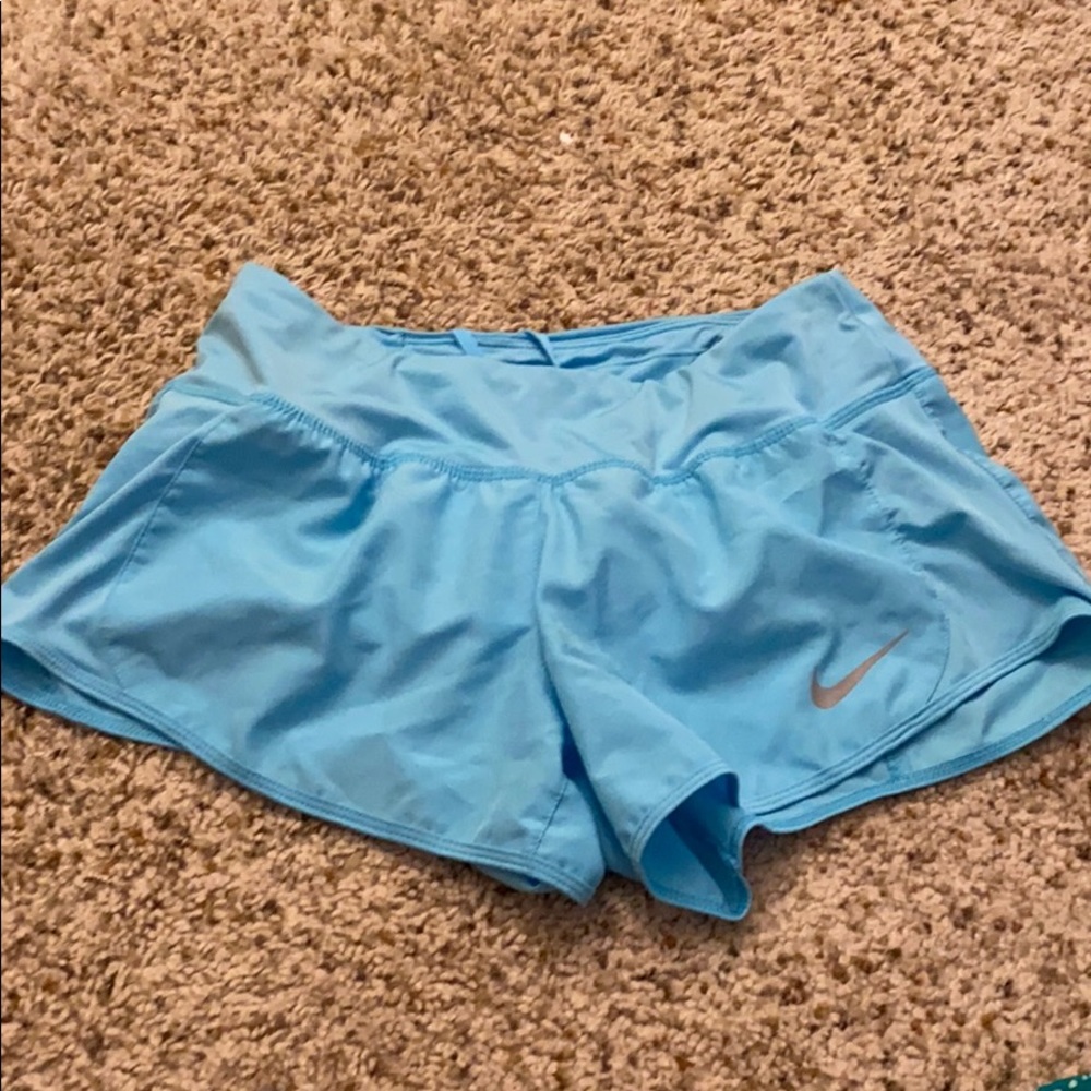 Light blue nike running shorts